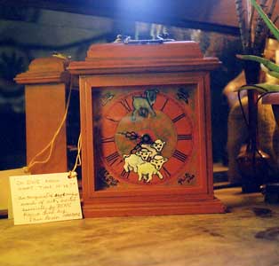 Hand-painted clock showing Bouvier herding sheep.