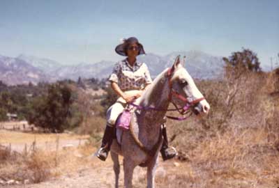 me and my Arab stallion Tambu, ready for a trail ride.